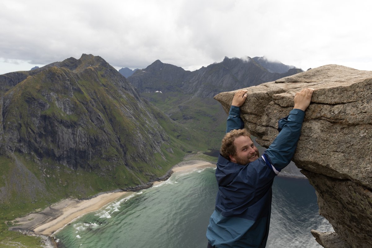 Man climbing along a cliff edge